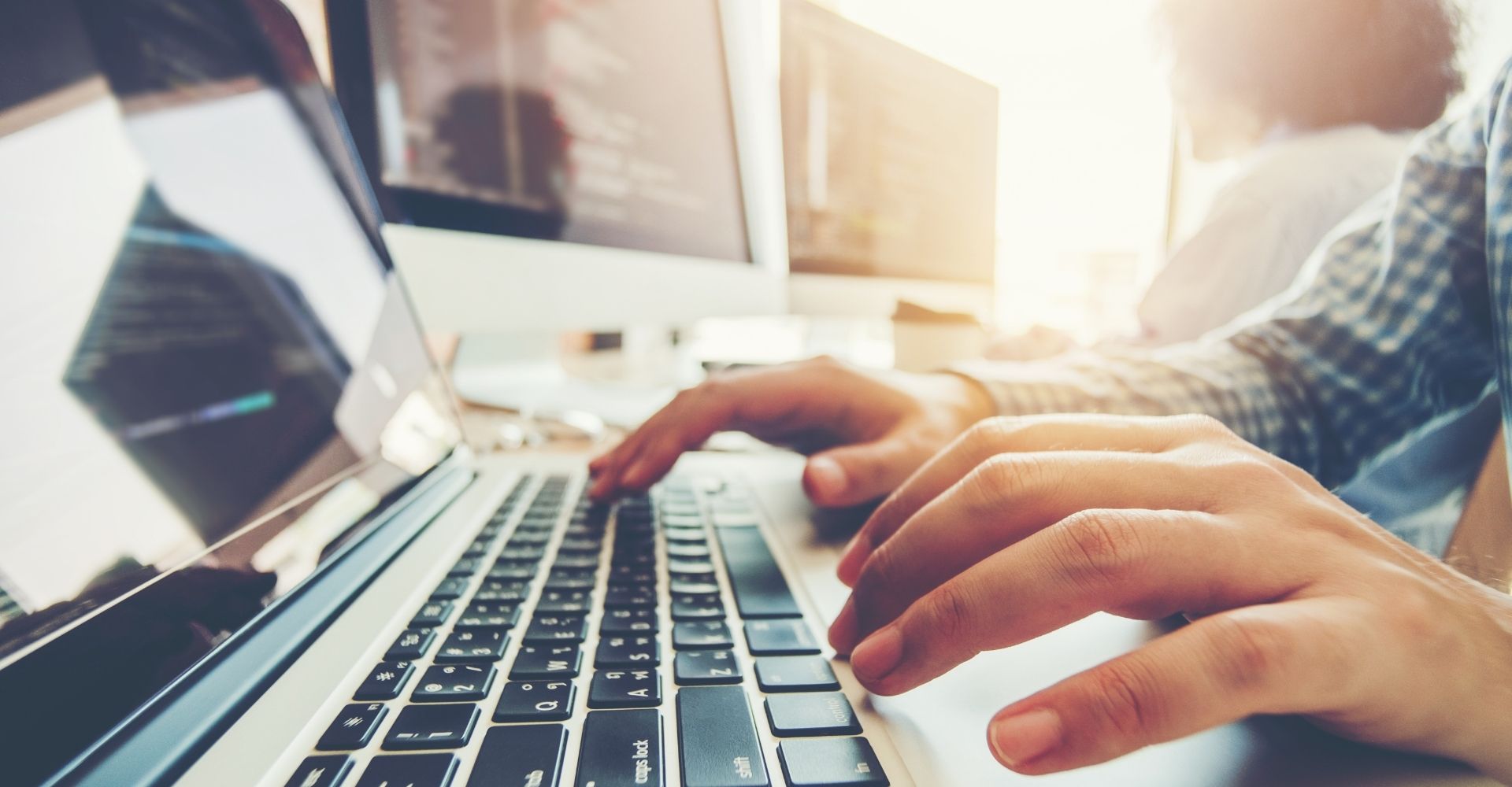 person typing on keyboard