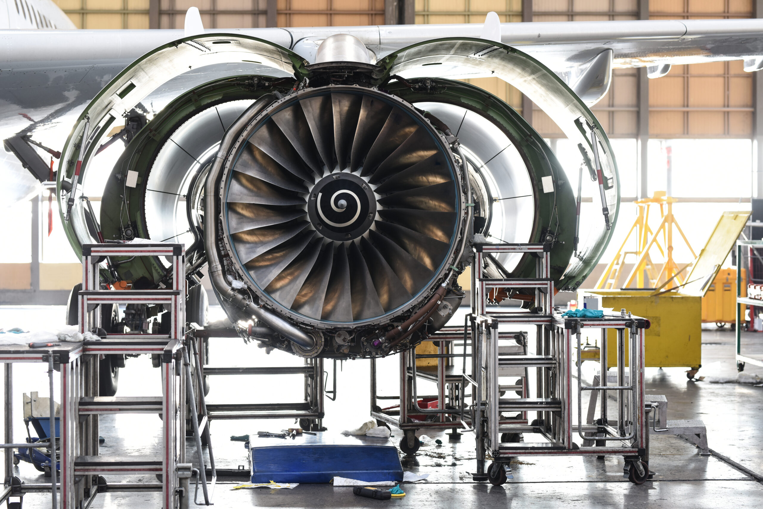 Aircraft Jet engine maintenance in airplane hangar